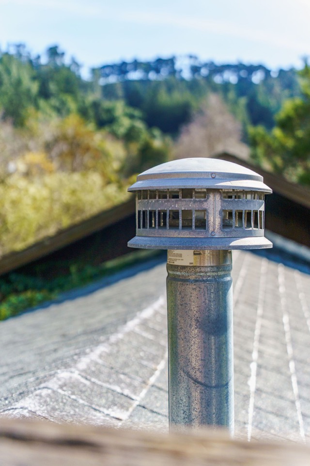 Cap and crown detail at the top of a chimney — Chimney Odor Removal in Pinecrest, FL