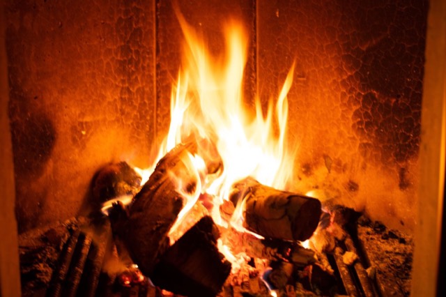 Living-room fireplace with a masonry surround — Pinecrest · Miami-Dade County