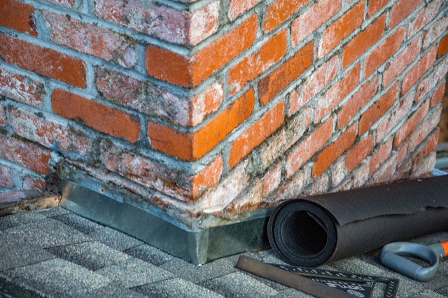 Step flashing where the chimney meets the shingles — Pinecrest · Miami-Dade County