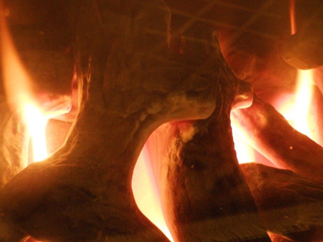 Gas log set alight inside a fireplace — Pinecrest · Miami-Dade County