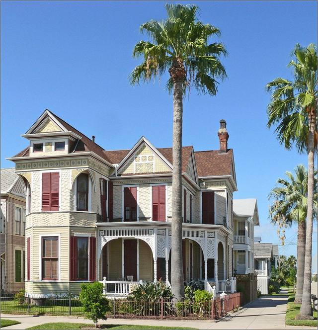 Two-story home with a brick chimney above the roofline — Local Chimney & Fireplace Company · Pinecrest, FL